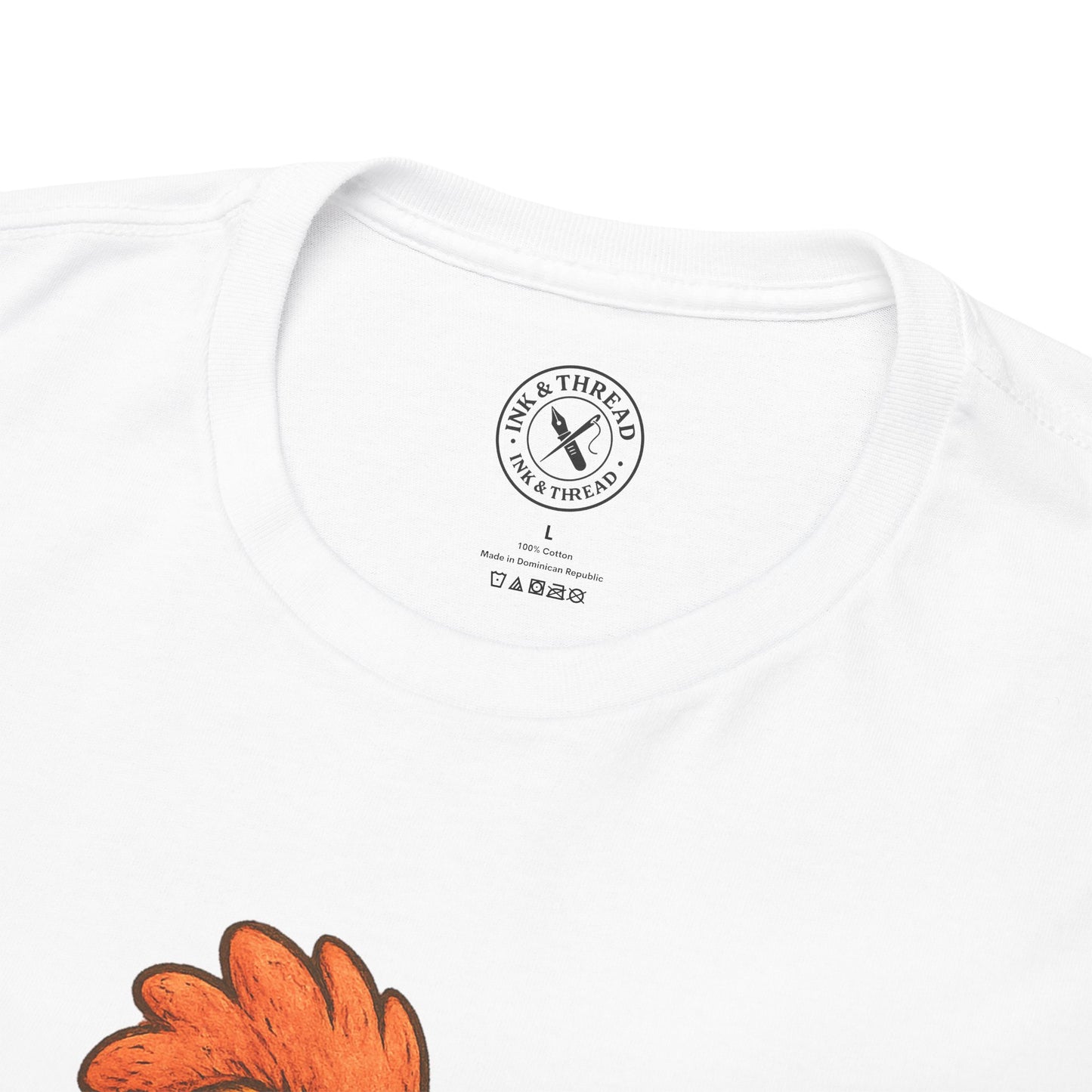 White t-shirt with a brand logo and orange leaf design on a white background
