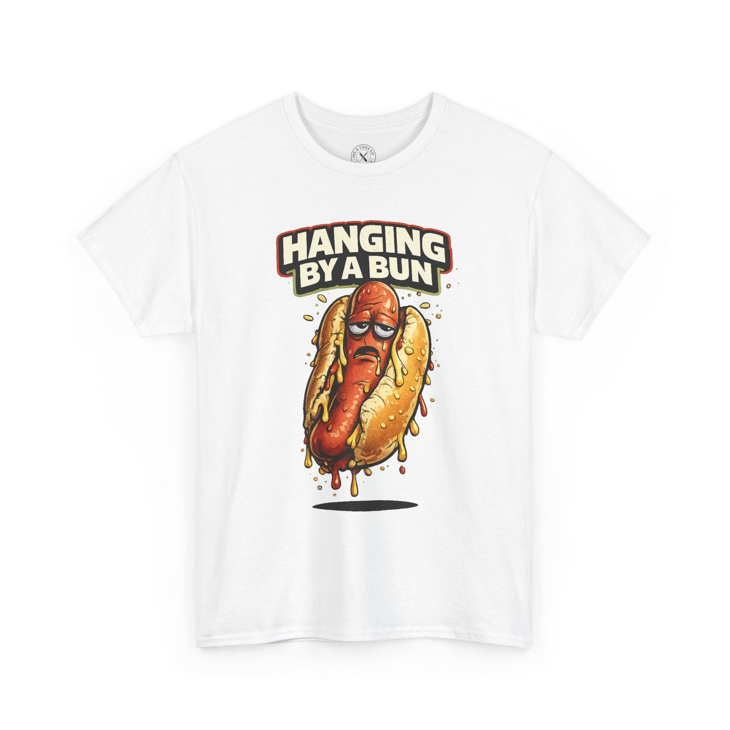 White t-shirt with a hot dog graphic and 'Hanging By A Bun' text on a white background
