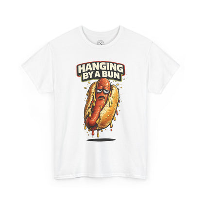 White t-shirt with a hot dog graphic and 'Hanging By A Bun' text on a white background