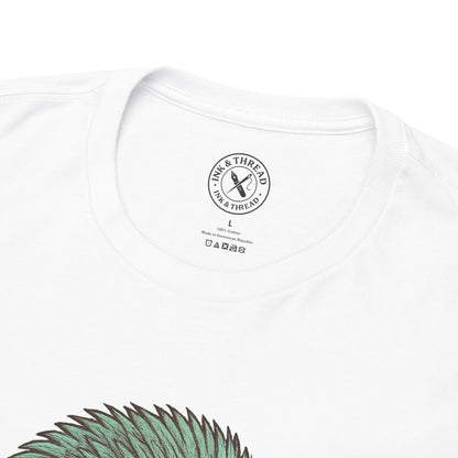 White t-shirt with a brand logo on the chest and green design at the bottom.