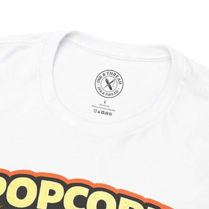 White t-shirt with colorful text and a brand logo on a white background
