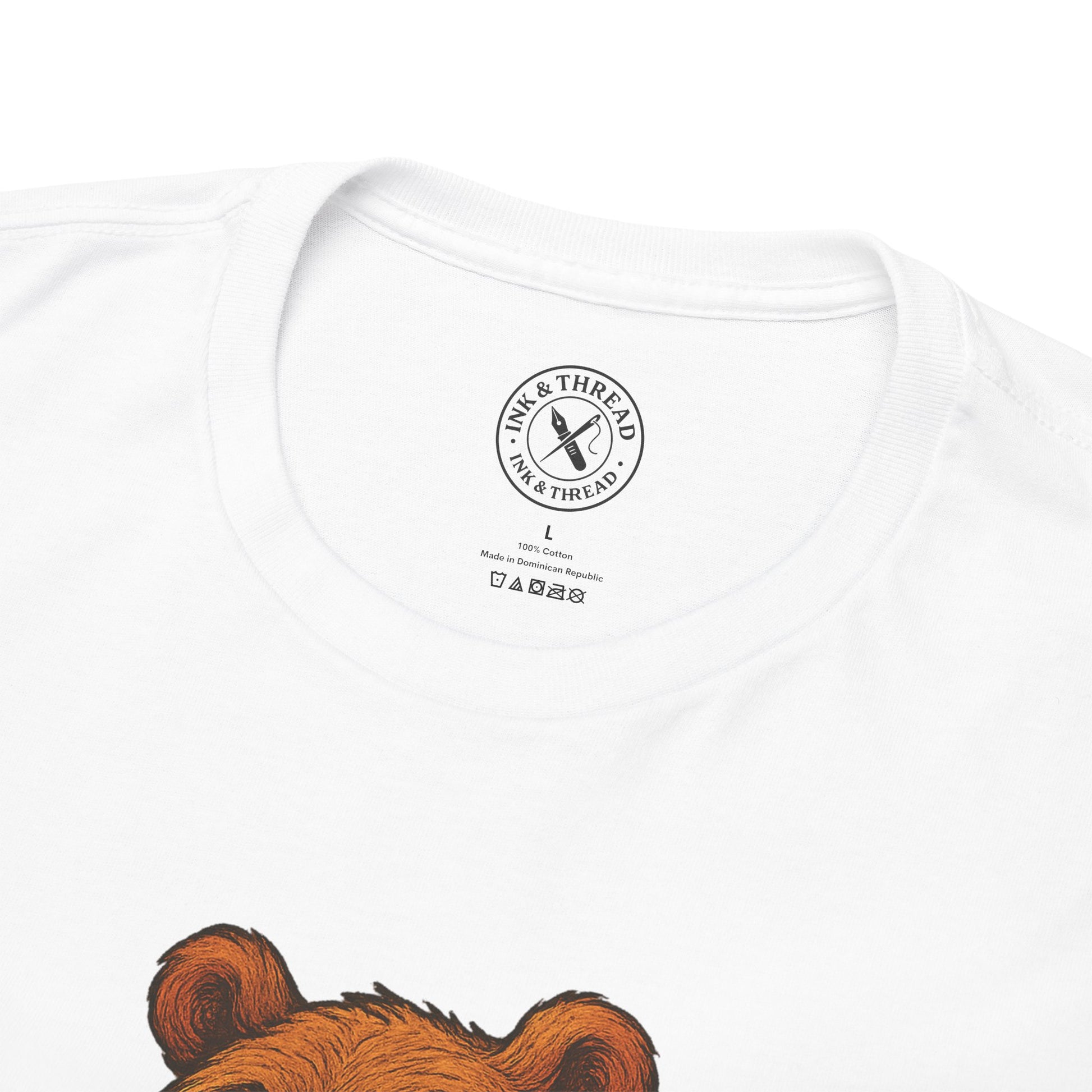White t-shirt with a brown bear graphic and 'Ink & Thread' logo on a white background