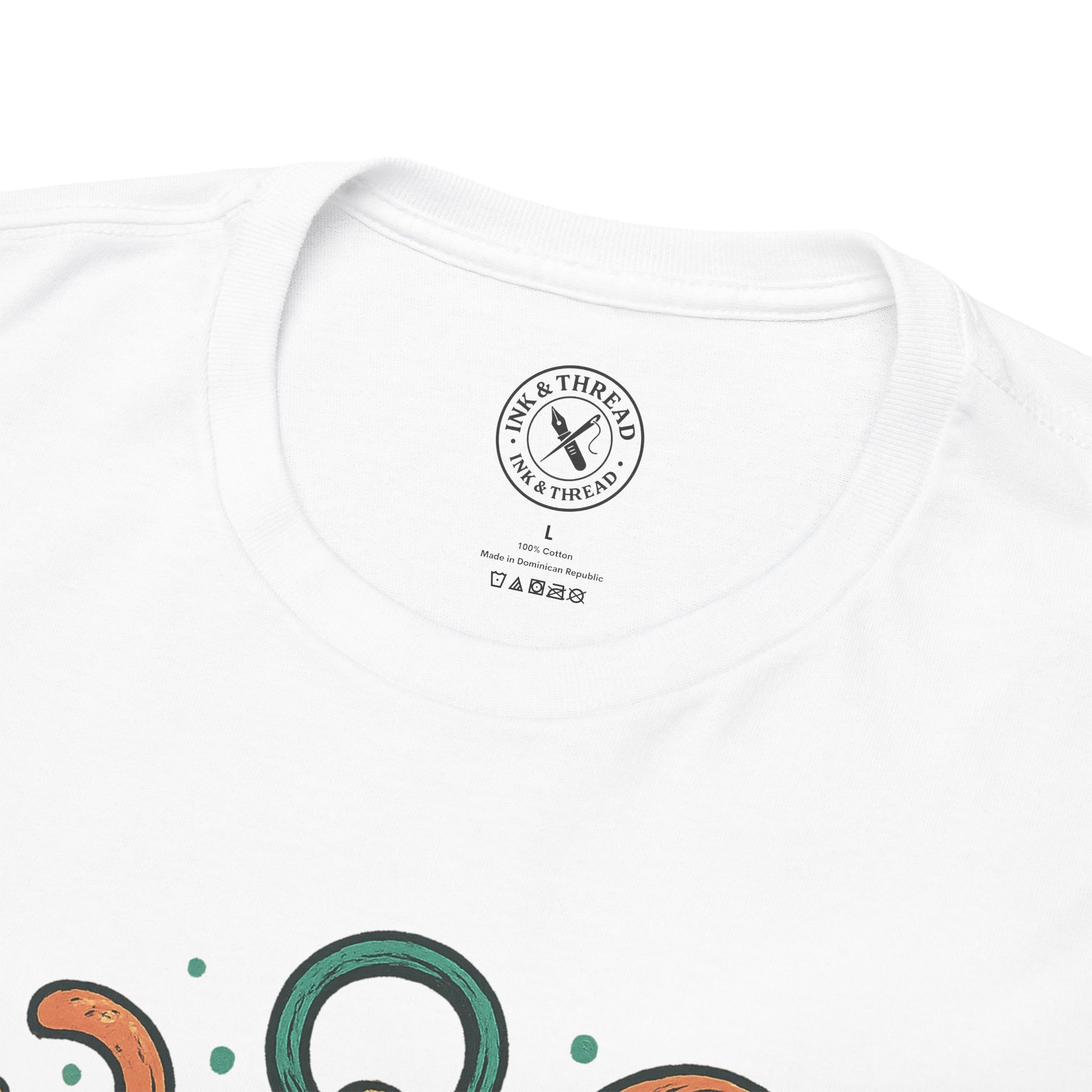White t-shirt with a brand logo on the chest and colorful designs at the bottom.