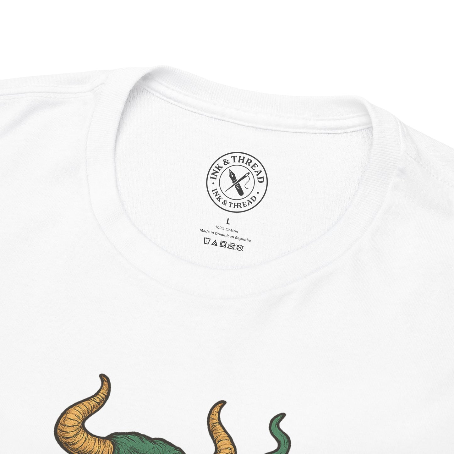 White t-shirt with a dinosaur graphic and 'Ink & Thread' logo on a white background