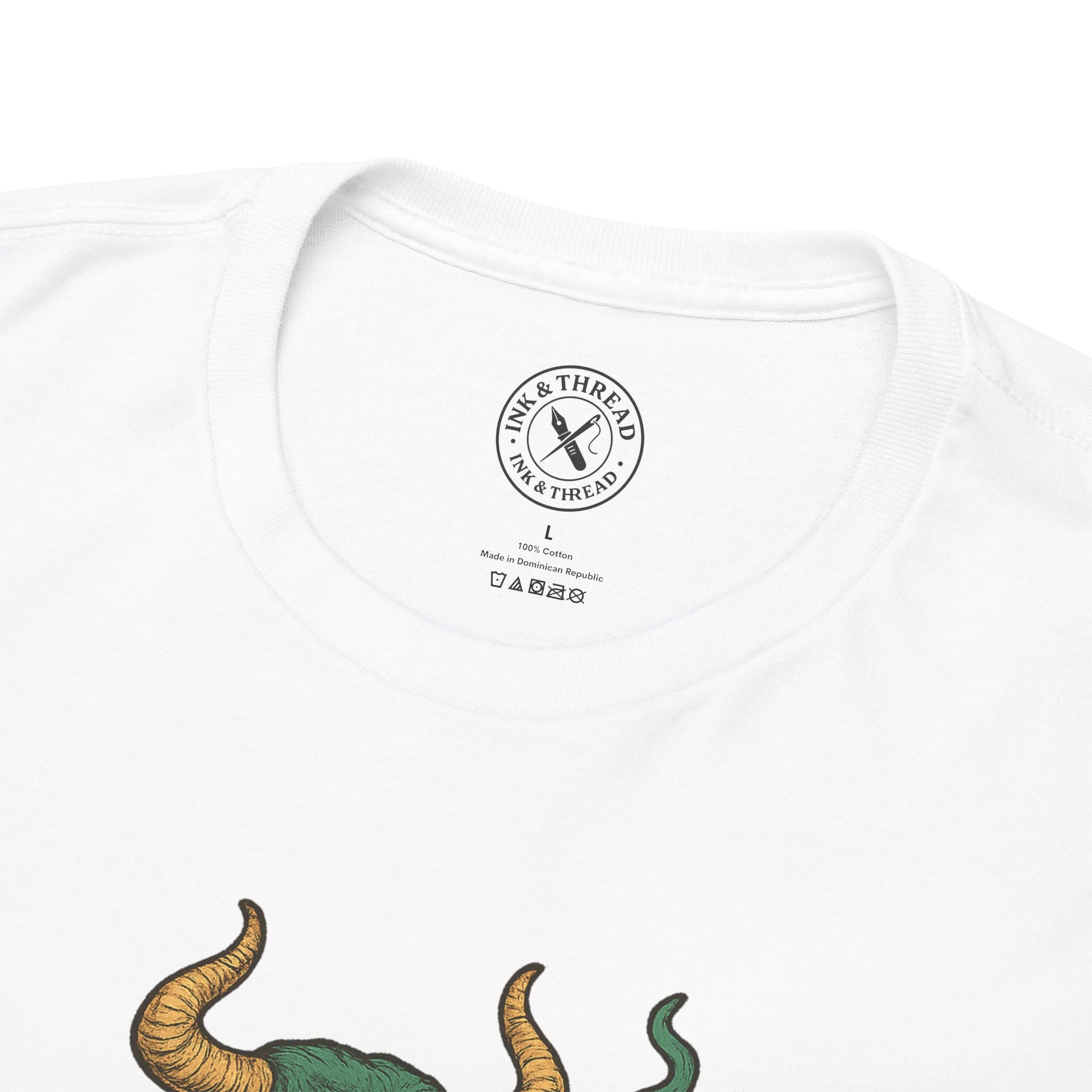 White t-shirt with a dinosaur graphic and 'Ink & Thread' logo on a white background