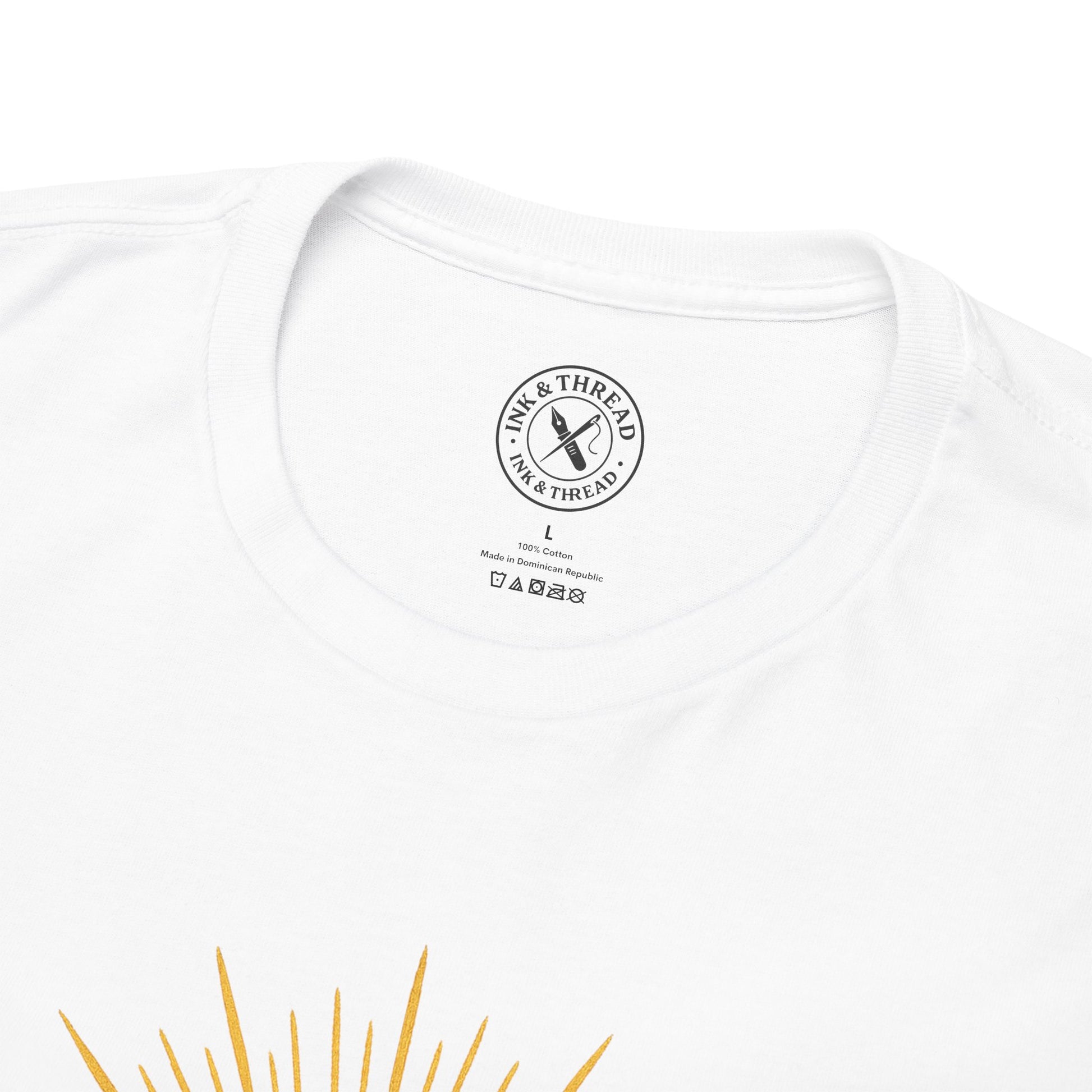 White t-shirt with a brand logo on the chest and yellow design at the bottom.