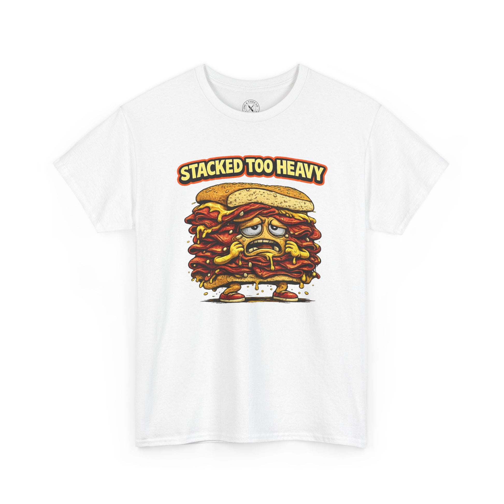 White t-shirt with a cartoon sandwich graphic and 'Stacked Too Heavy' text on a white background