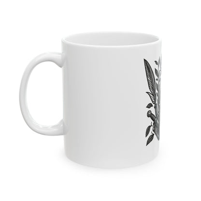 White mug with black leaf design on a white background