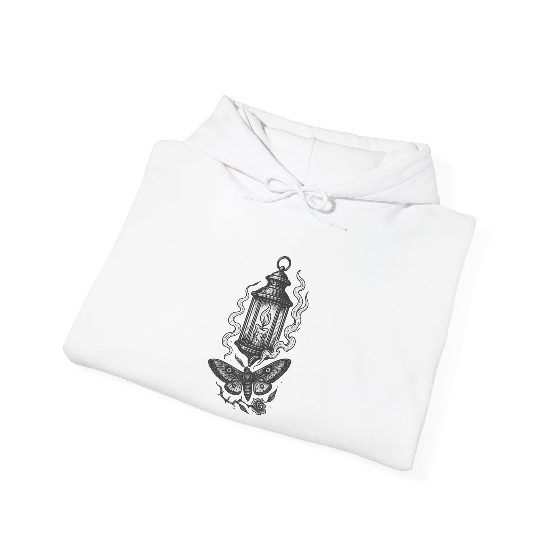 White shirt with black lantern and butterfly design on a white background