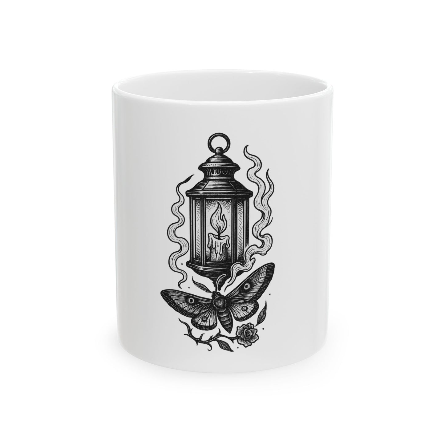 White mug with black lantern and moth design on a white background