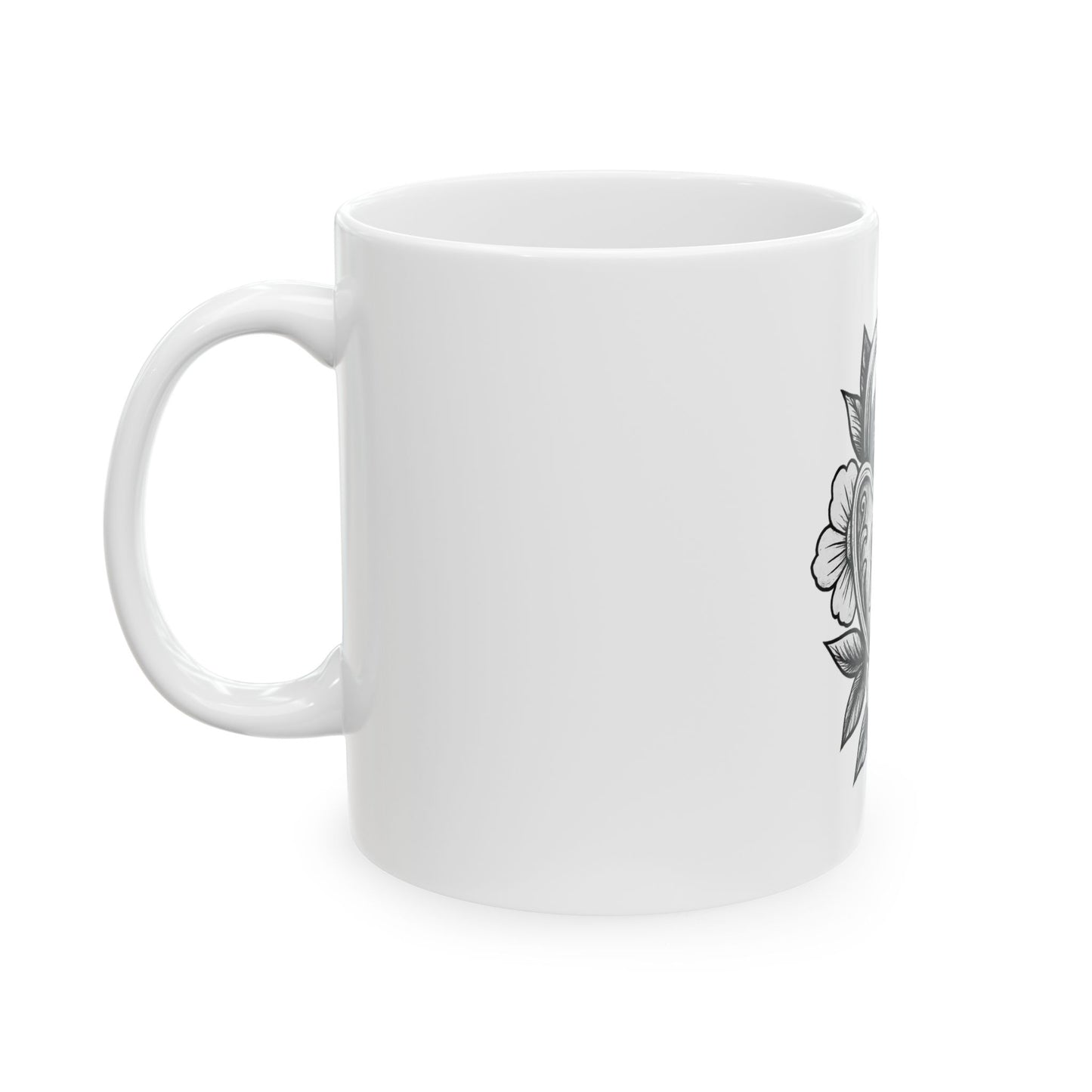 White mug with black floral design on a white background