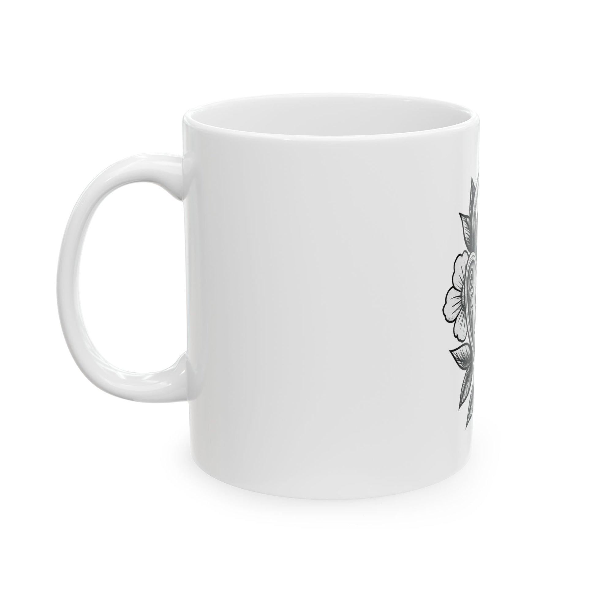 White mug with black floral design on a white background