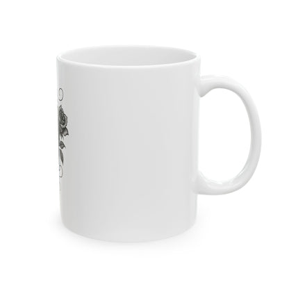 White mug with black floral design on a white background
