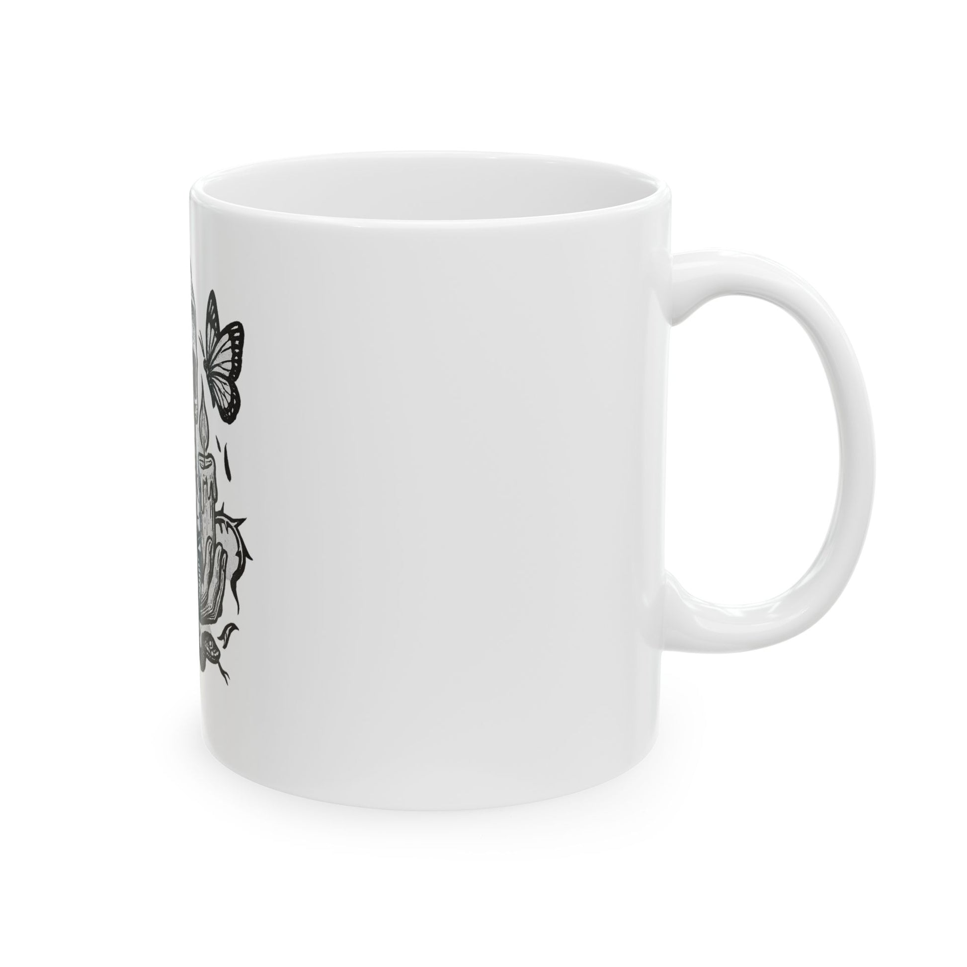 White mug with black butterfly illustrations on a white background