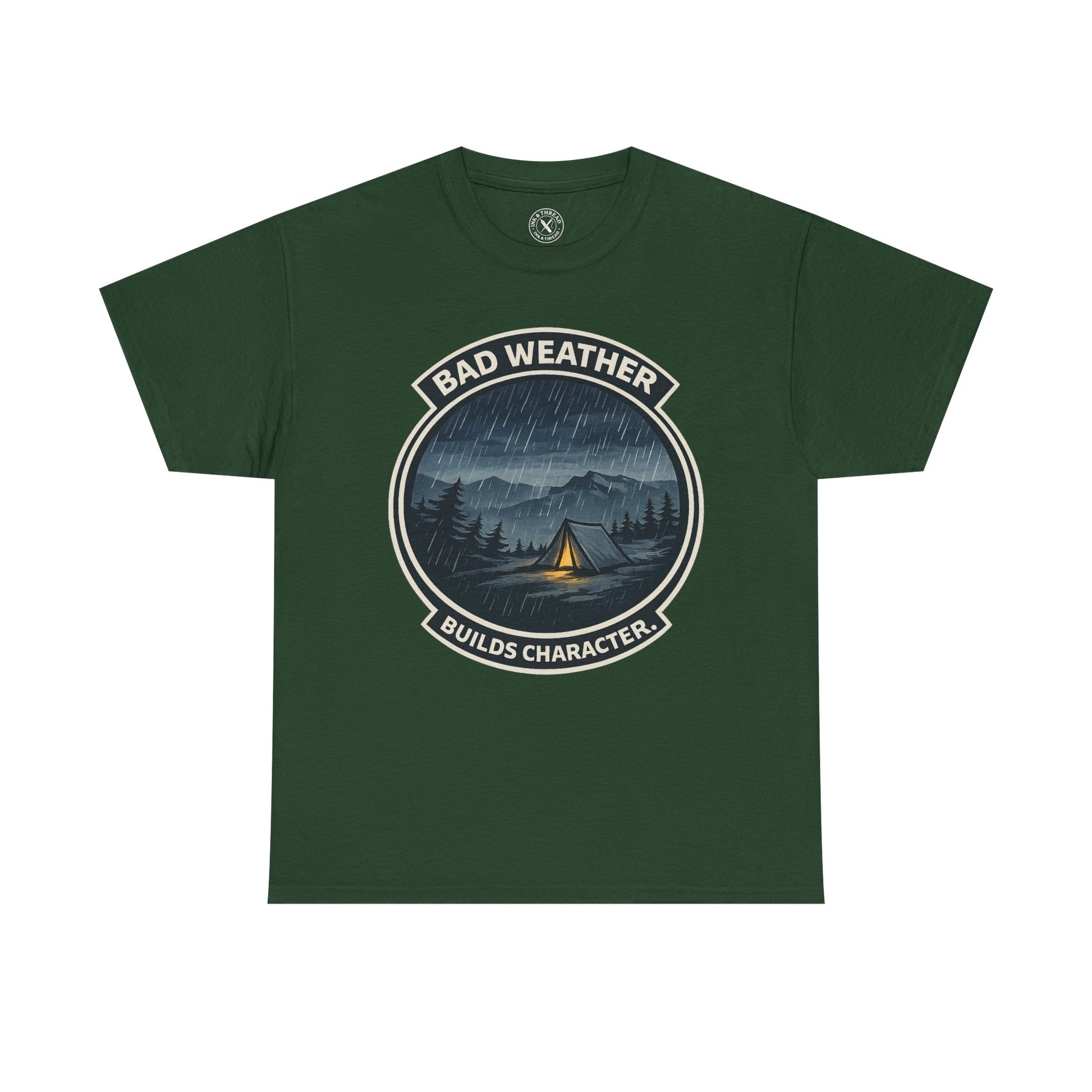Forest green unisex t-shirt featuring Bad Weather Builds Character camping badge graphic with rainy tent scene and mountain design