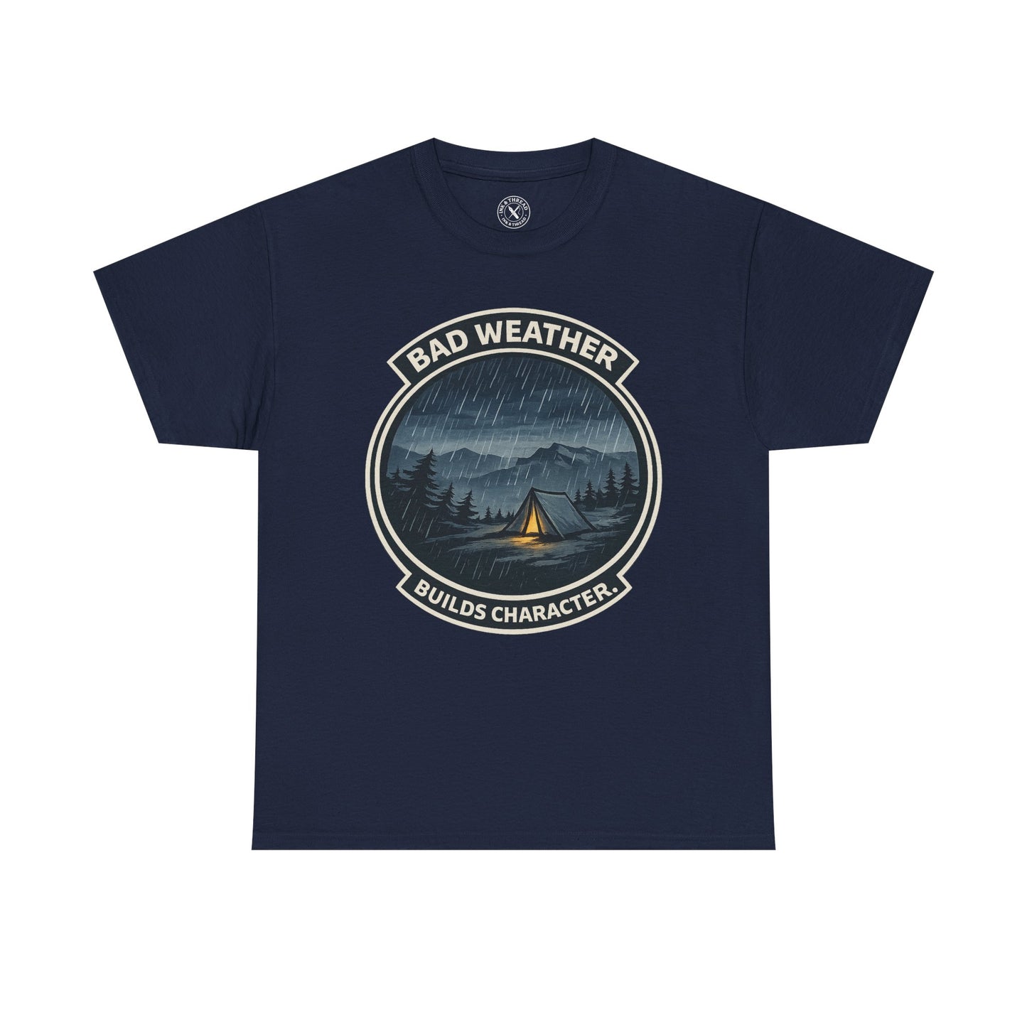 Navy blue unisex t-shirt featuring Bad Weather Builds Character camping badge graphic with rainy tent scene and mountain design