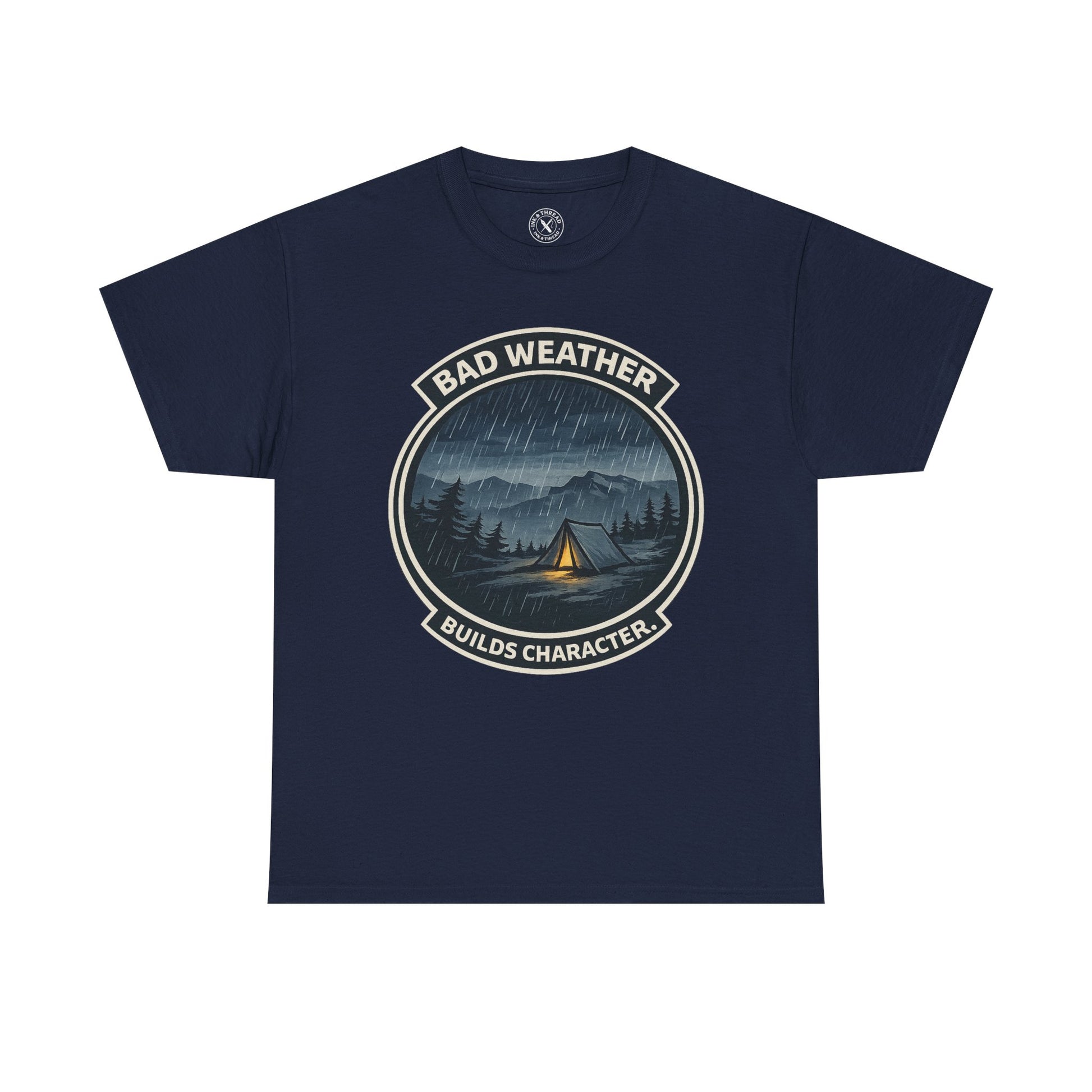 Navy blue unisex t-shirt featuring Bad Weather Builds Character camping badge graphic with rainy tent scene and mountain design