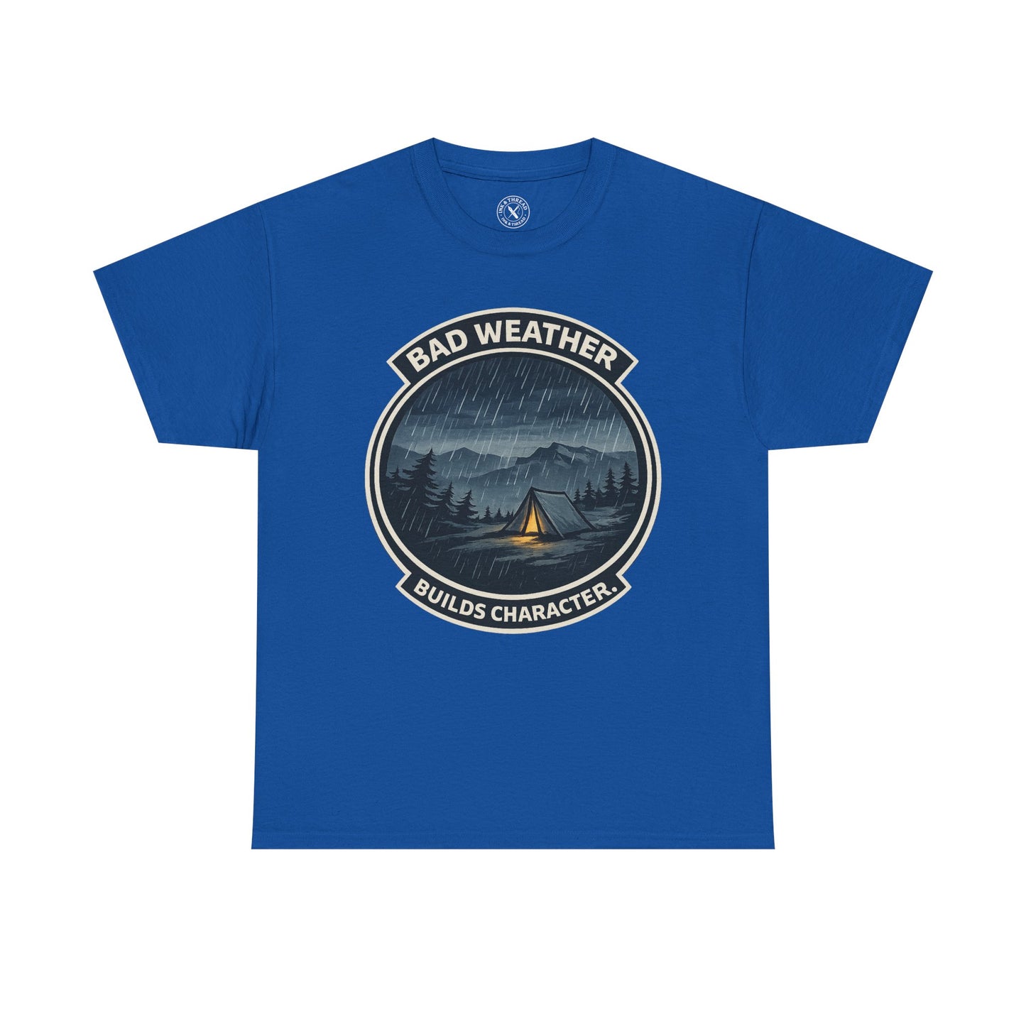 Royal blue unisex t-shirt featuring Bad Weather Builds Character camping badge graphic with rainy tent scene and mountain design