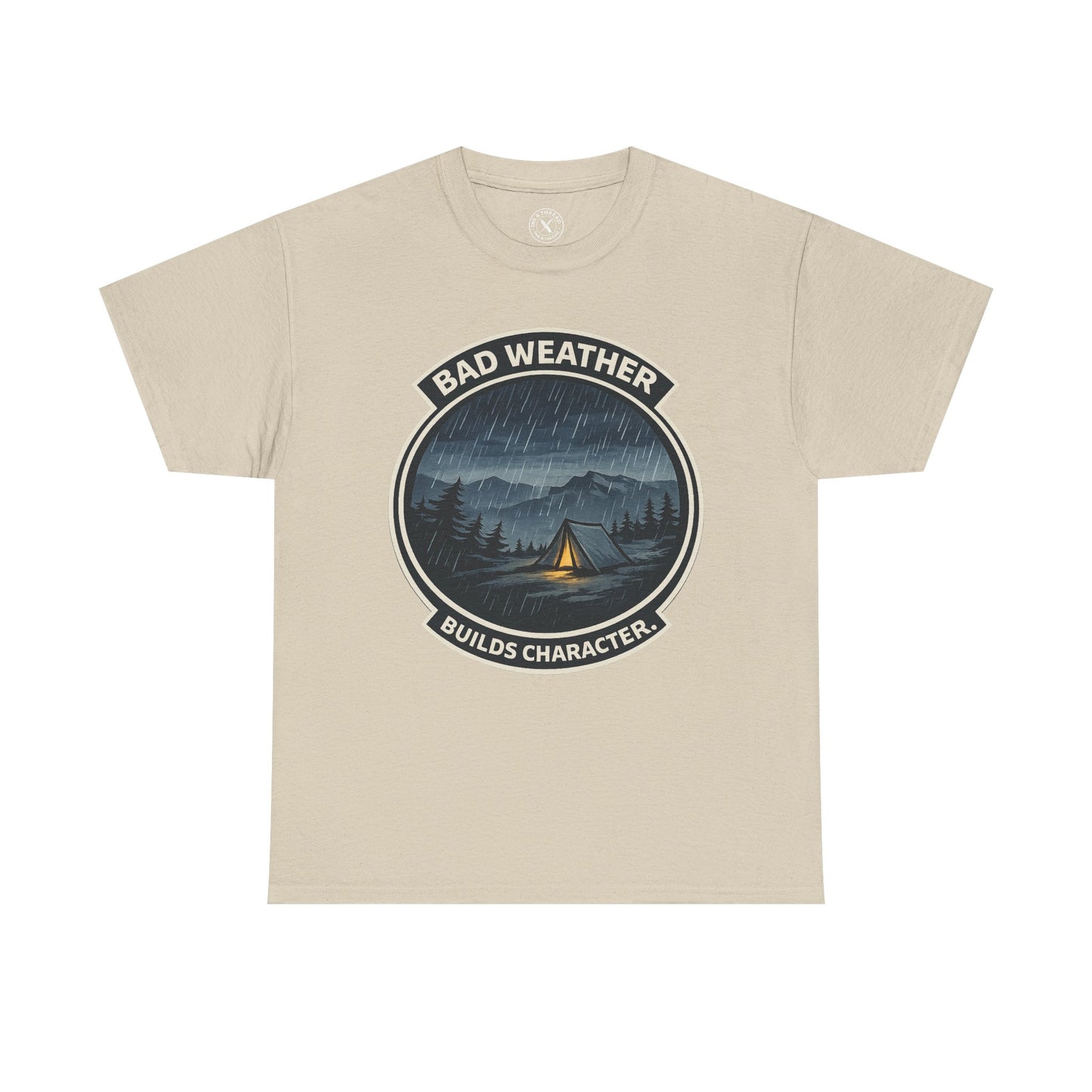 Sand beige unisex t-shirt featuring Bad Weather Builds Character camping badge graphic with rainy tent scene and mountain design