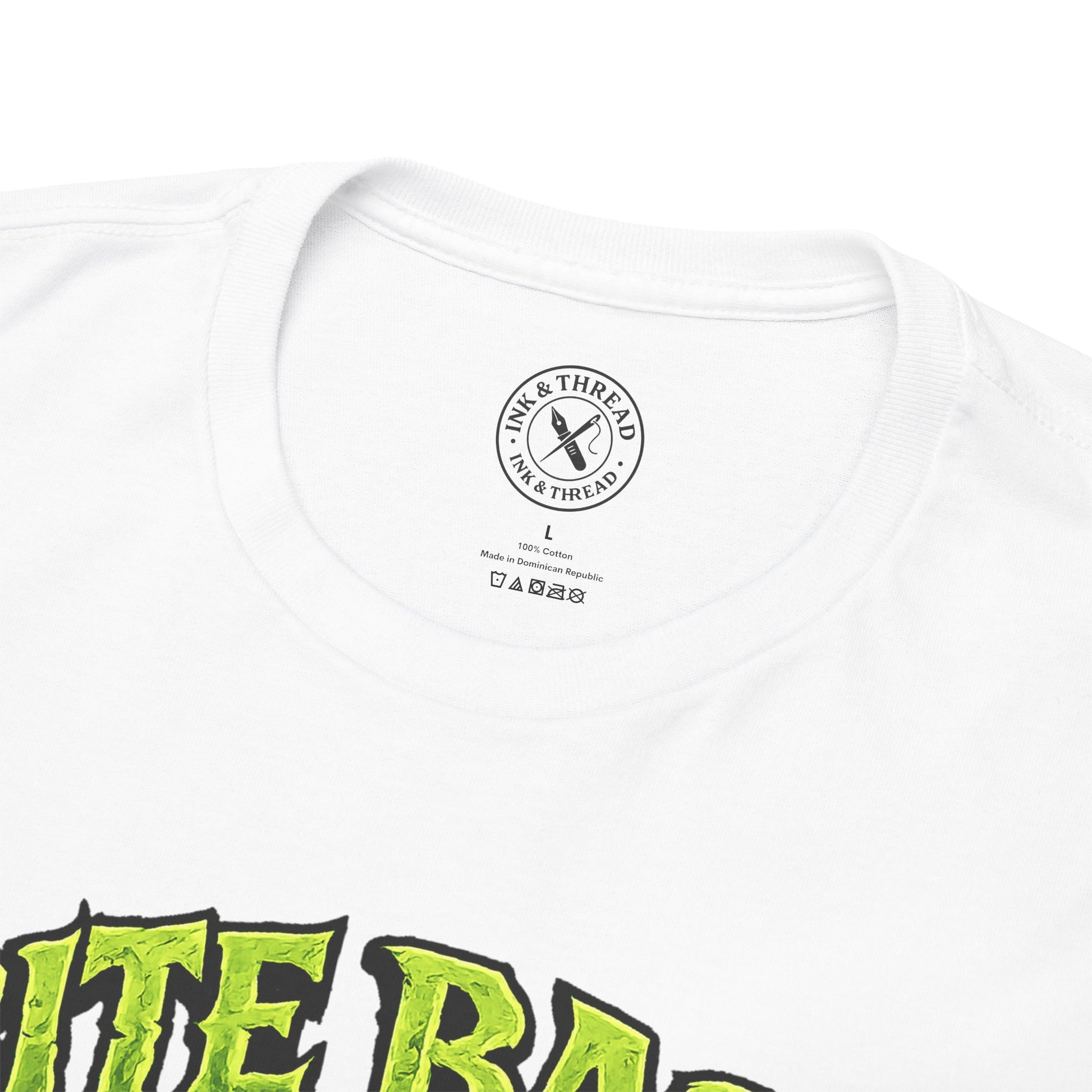 Close-up of Ink & Thread UK branded neck label on Bite Back t-shirt showing quality branding and care instructions