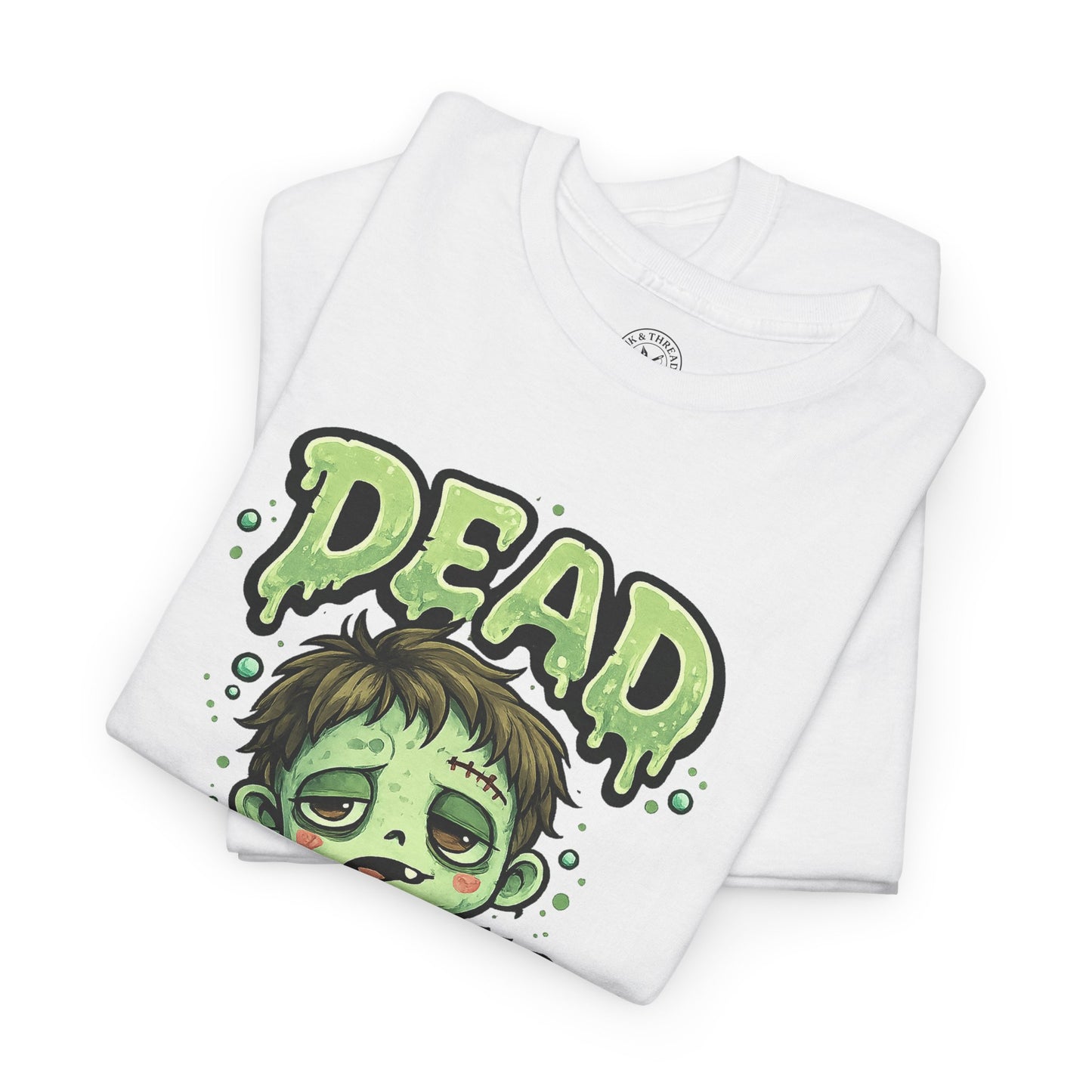Dead Cute Zombie Halloween T-Shirt in White - Folded View with Cute Zombie Boy Design