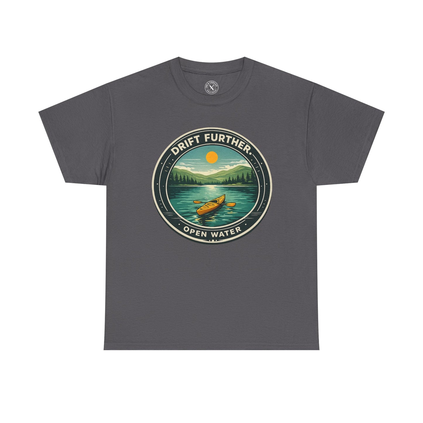 Charcoal grey unisex t-shirt featuring Drift Further Open Water kayaking circular badge graphic with canoe on lake and sun design
