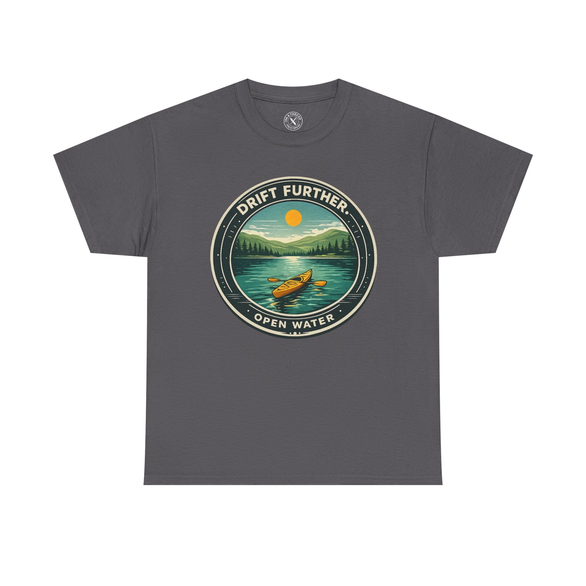 Charcoal grey unisex t-shirt featuring Drift Further Open Water kayaking circular badge graphic with canoe on lake and sun design