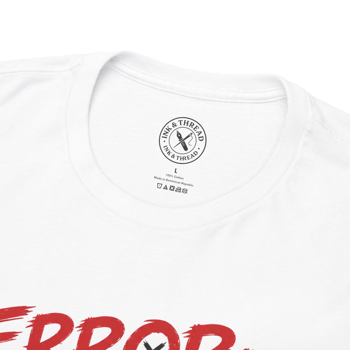 Close-up of the Ink & Thread branded collar label on the Error Motivation Not Found graphic t-shirt.