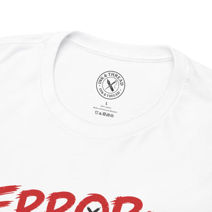 Close-up of the Ink & Thread branded collar label on the Error Motivation Not Found graphic t-shirt.