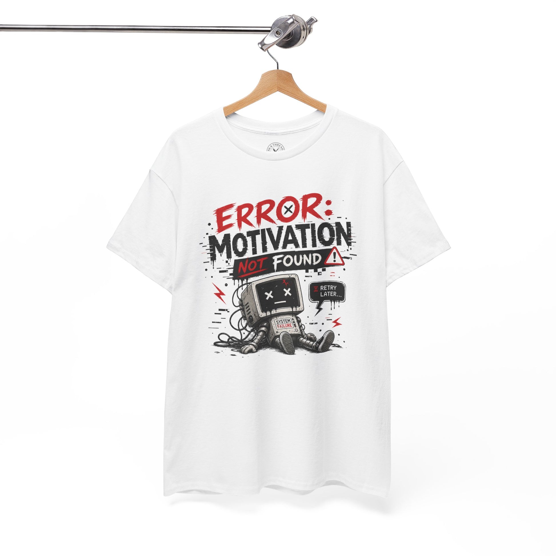Error Motivation Not Found graphic t-shirt hanging on a wooden hanger with robot artwork and distressed text design.