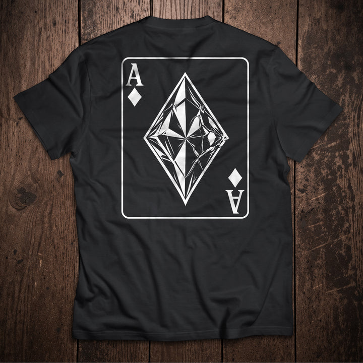 Black t-shirt with ace of diamonds card design featuring geometric crystal diamond on wooden surface