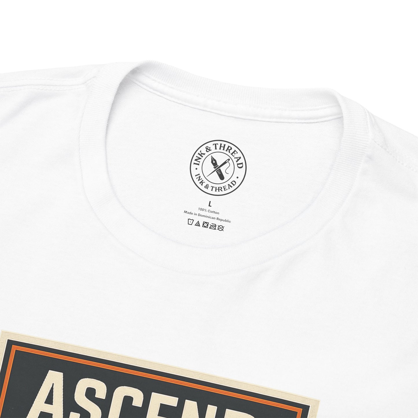 Close-up of Ink & Thread UK branded inner neck label on white t-shirt with Ascend Elevation Series climbing graphic design and care instructions
