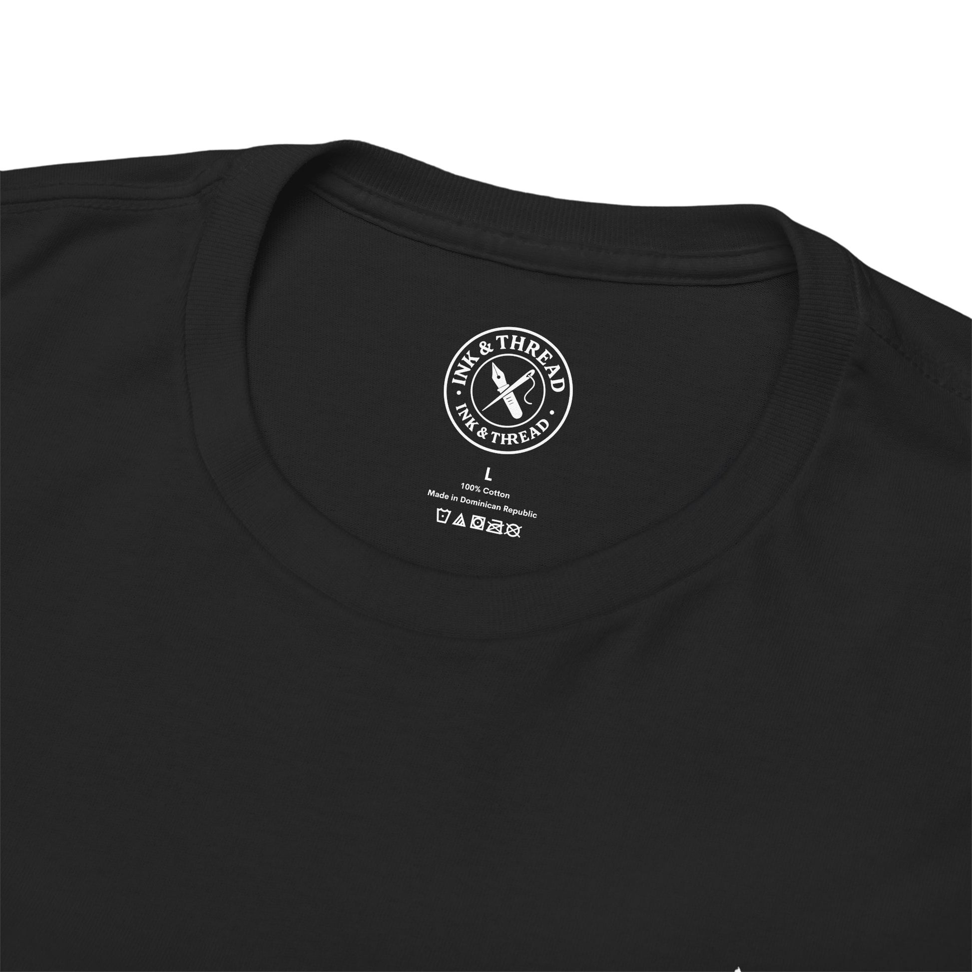 Black t-shirt with a brand logo on the collar area against a white background
