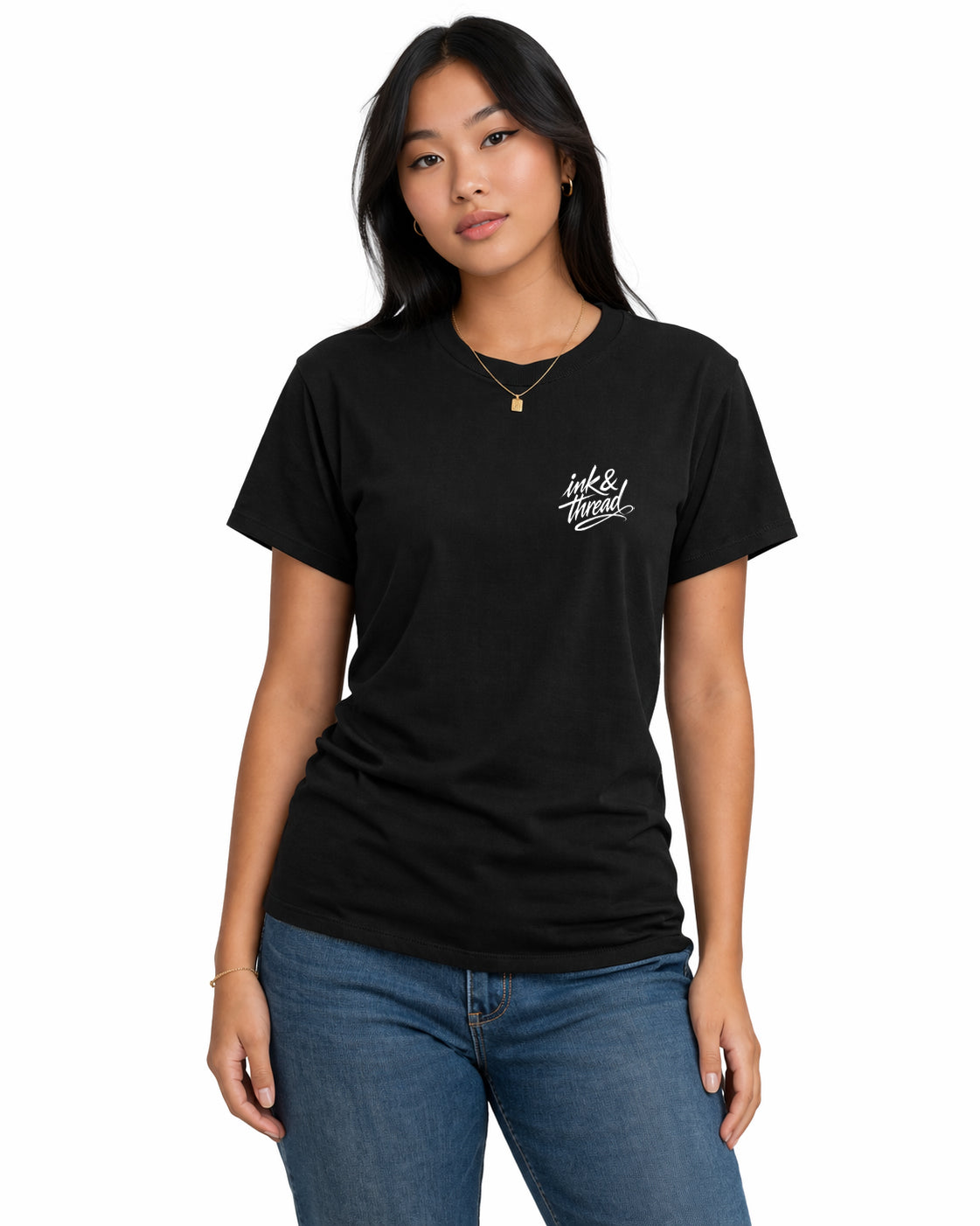 Female model wearing black t-shirt with Ink and Thread script logo on left chest against white background