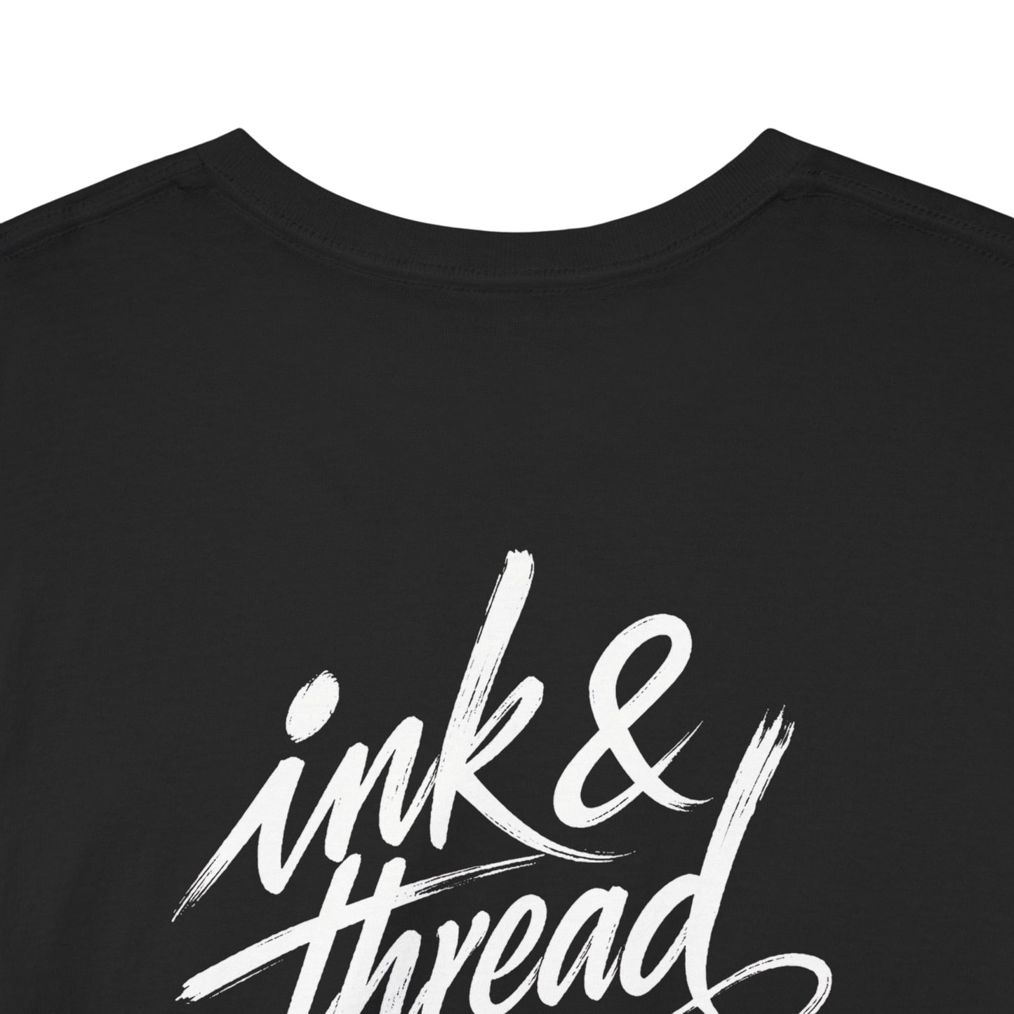 Back close-up of black t-shirt with large Ink and Thread brush script calligraphy print on white background