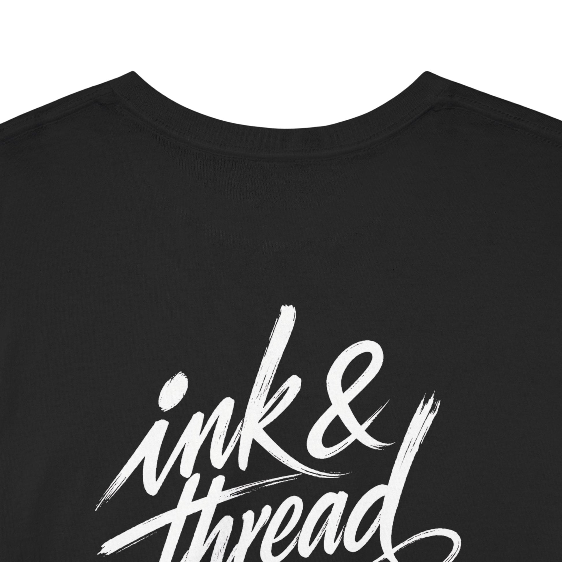 Back close-up of black t-shirt with large Ink and Thread brush script calligraphy print on white background