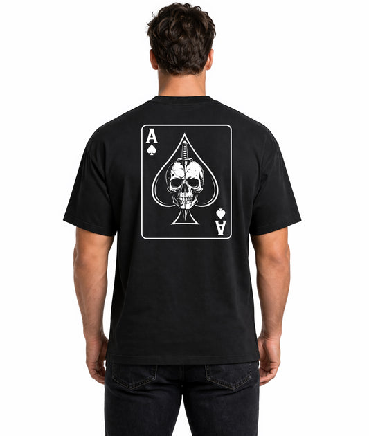 Male model showing back of black t-shirt with Ace of Spades playing card design featuring skull and dagger illustration on white background