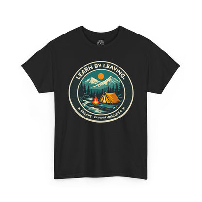 Black relaxed fit unisex t-shirt featuring Learn By Leaving camping circular badge graphic with tent, campfire, mountains and escape explore discover design