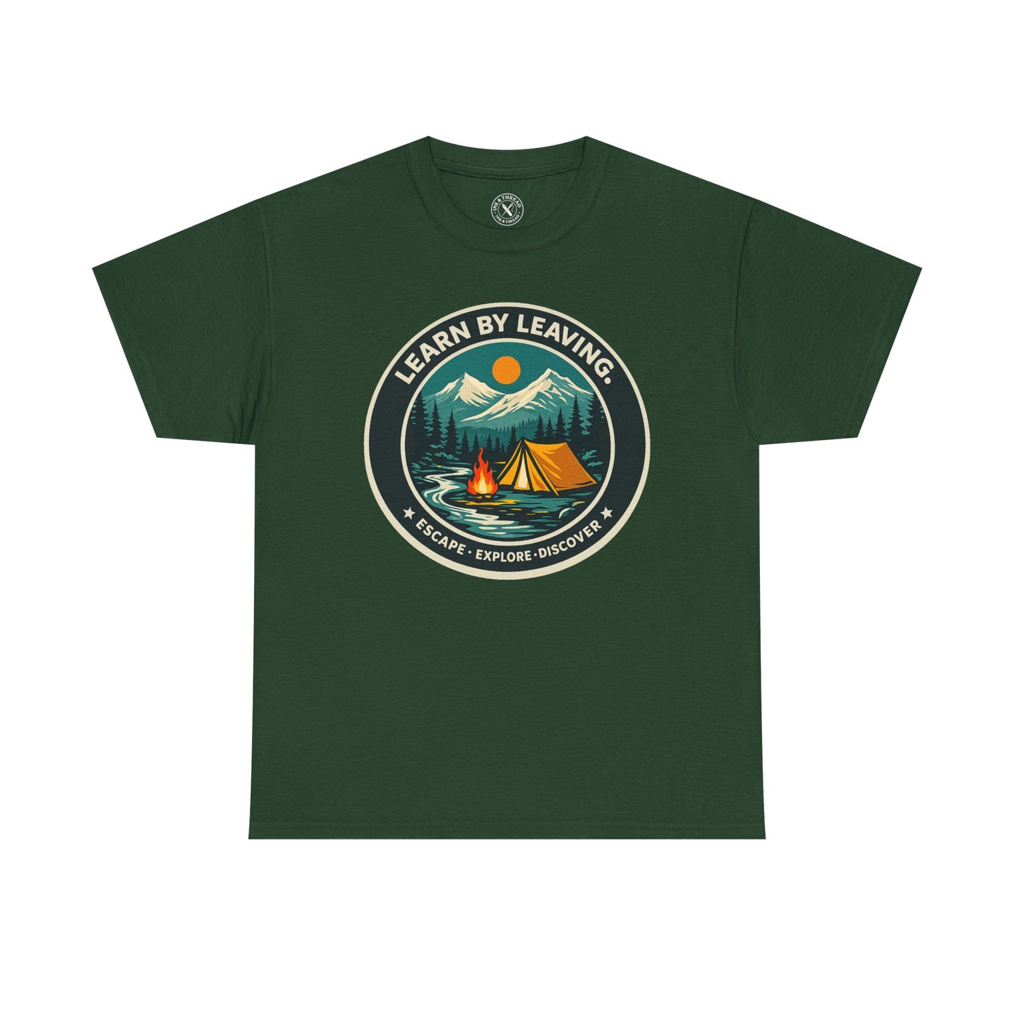 Forest green unisex t-shirt featuring Learn By Leaving camping circular badge graphic with tent, campfire, mountains and escape explore discover design