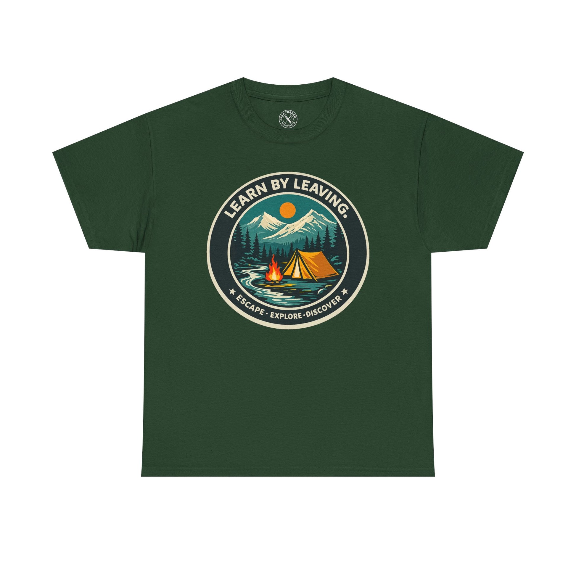 Forest green unisex t-shirt featuring Learn By Leaving camping circular badge graphic with tent, campfire, mountains and escape explore discover design