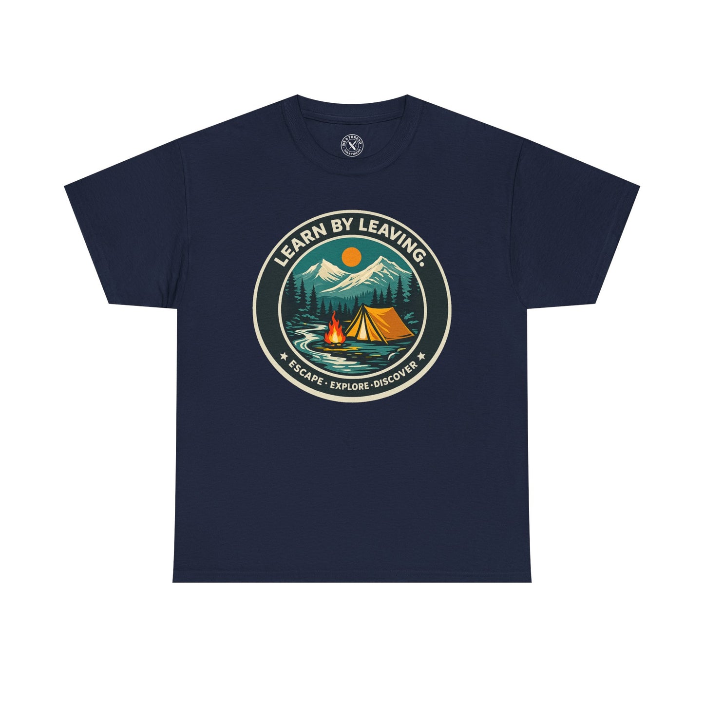 Navy blue unisex t-shirt featuring Learn By Leaving camping circular badge graphic with tent, campfire, mountains and escape explore discover design