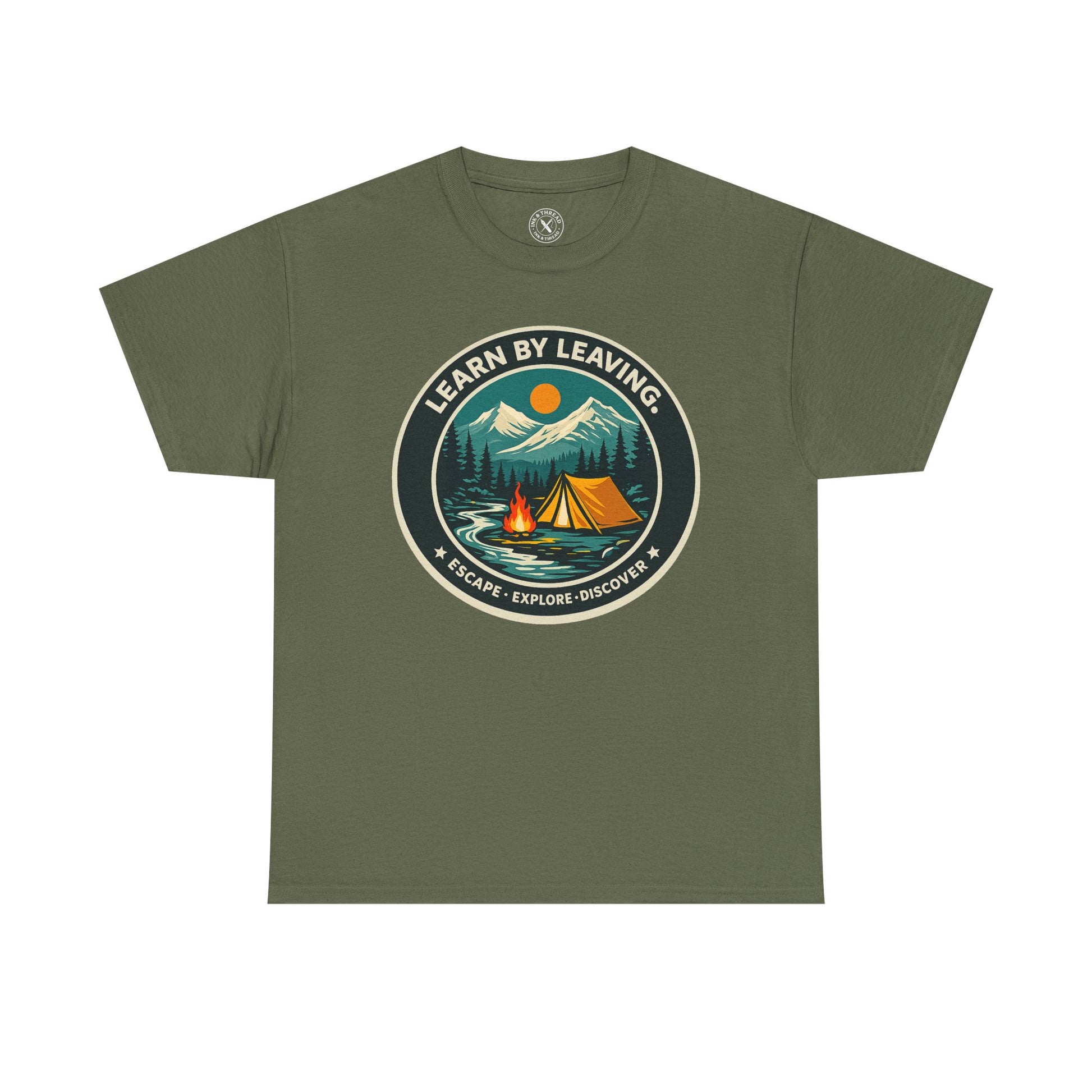 Olive green unisex t-shirt featuring Learn By Leaving camping circular badge graphic with tent, campfire, mountains and escape explore discover design