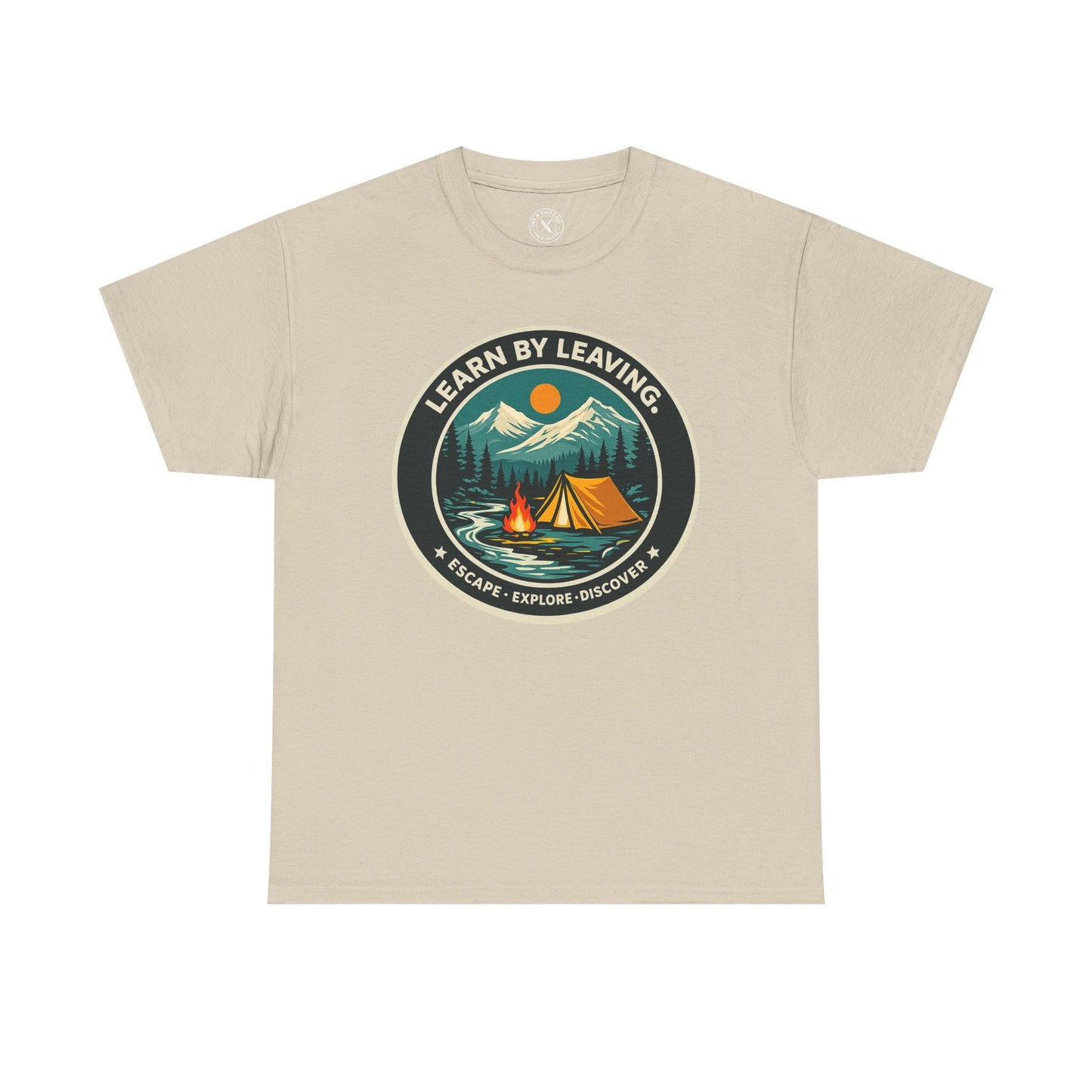 Sand beige unisex t-shirt featuring Learn By Leaving camping circular badge graphic with tent, campfire, mountains and escape explore discover design