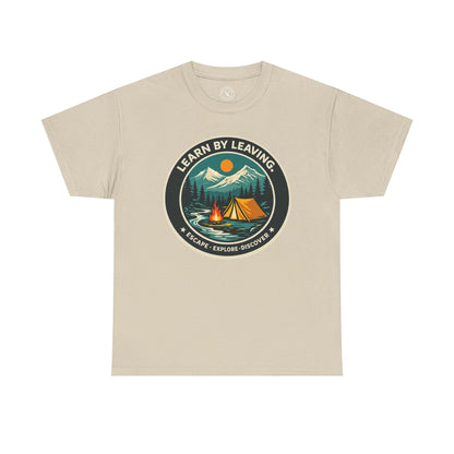 Sand beige unisex t-shirt featuring Learn By Leaving camping circular badge graphic with tent, campfire, mountains and escape explore discover design