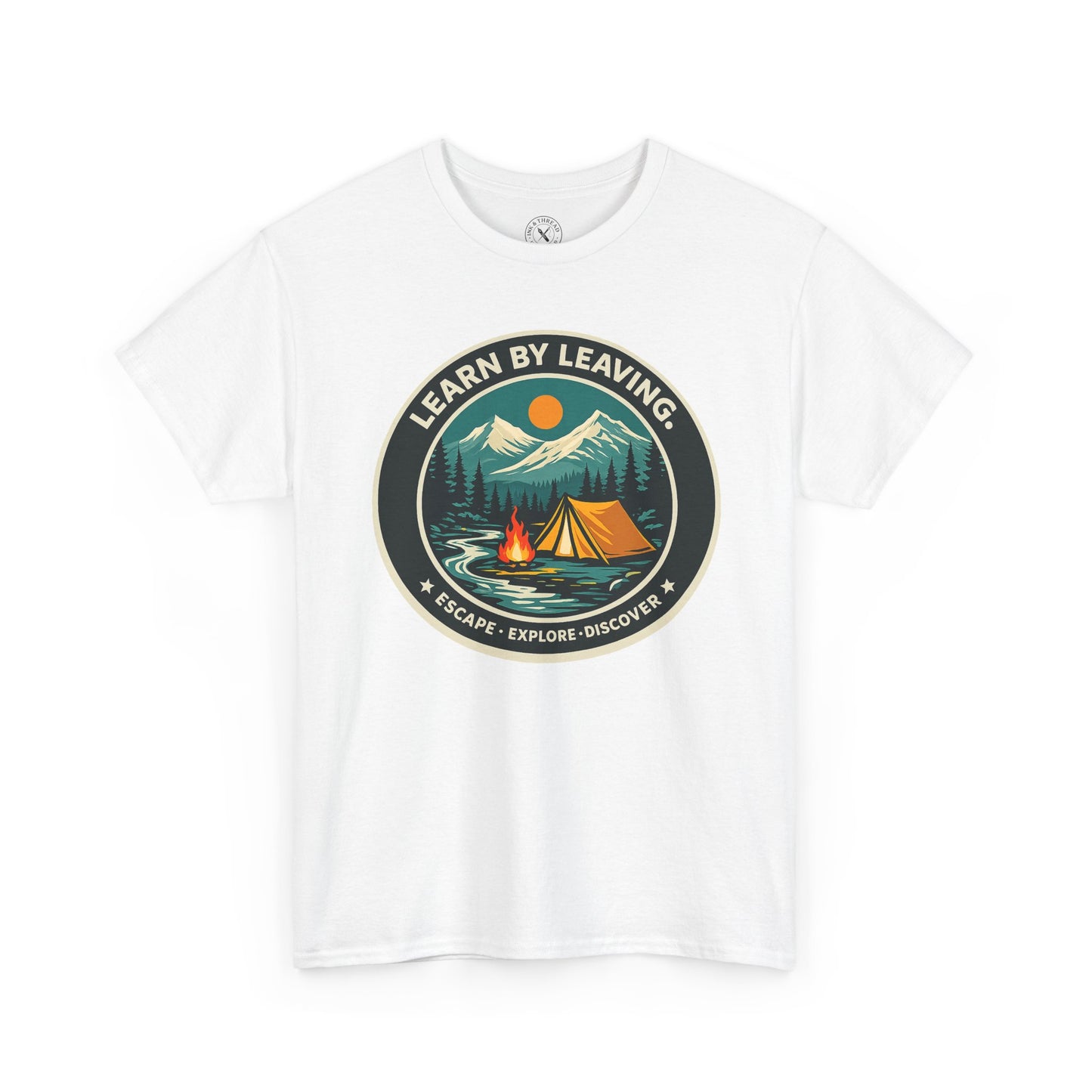 White unisex t-shirt featuring Learn By Leaving camping circular badge graphic with tent, campfire, mountains and escape explore discover design
