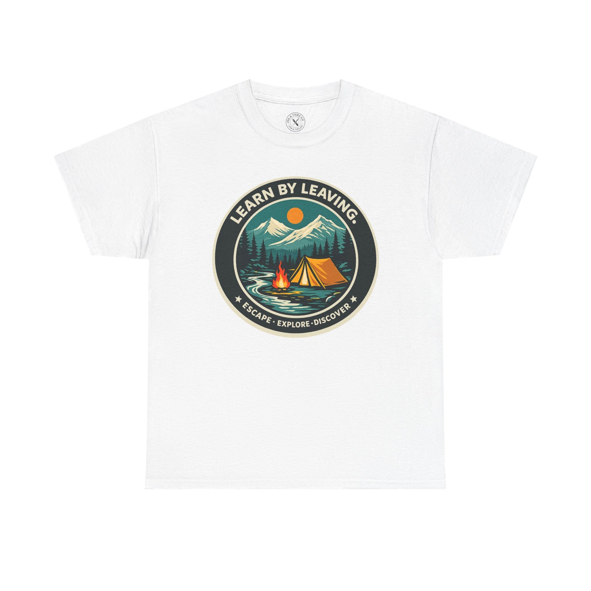 White relaxed fit unisex t-shirt featuring Learn By Leaving camping circular badge graphic with tent, campfire, mountains and escape explore discover design
