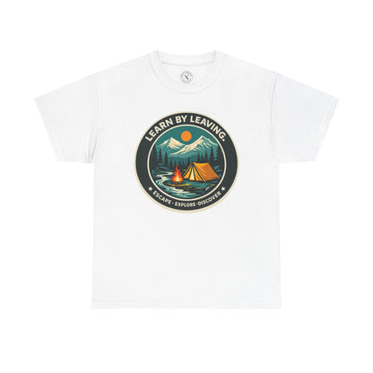 White relaxed fit unisex t-shirt featuring Learn By Leaving camping circular badge graphic with tent, campfire, mountains and escape explore discover design