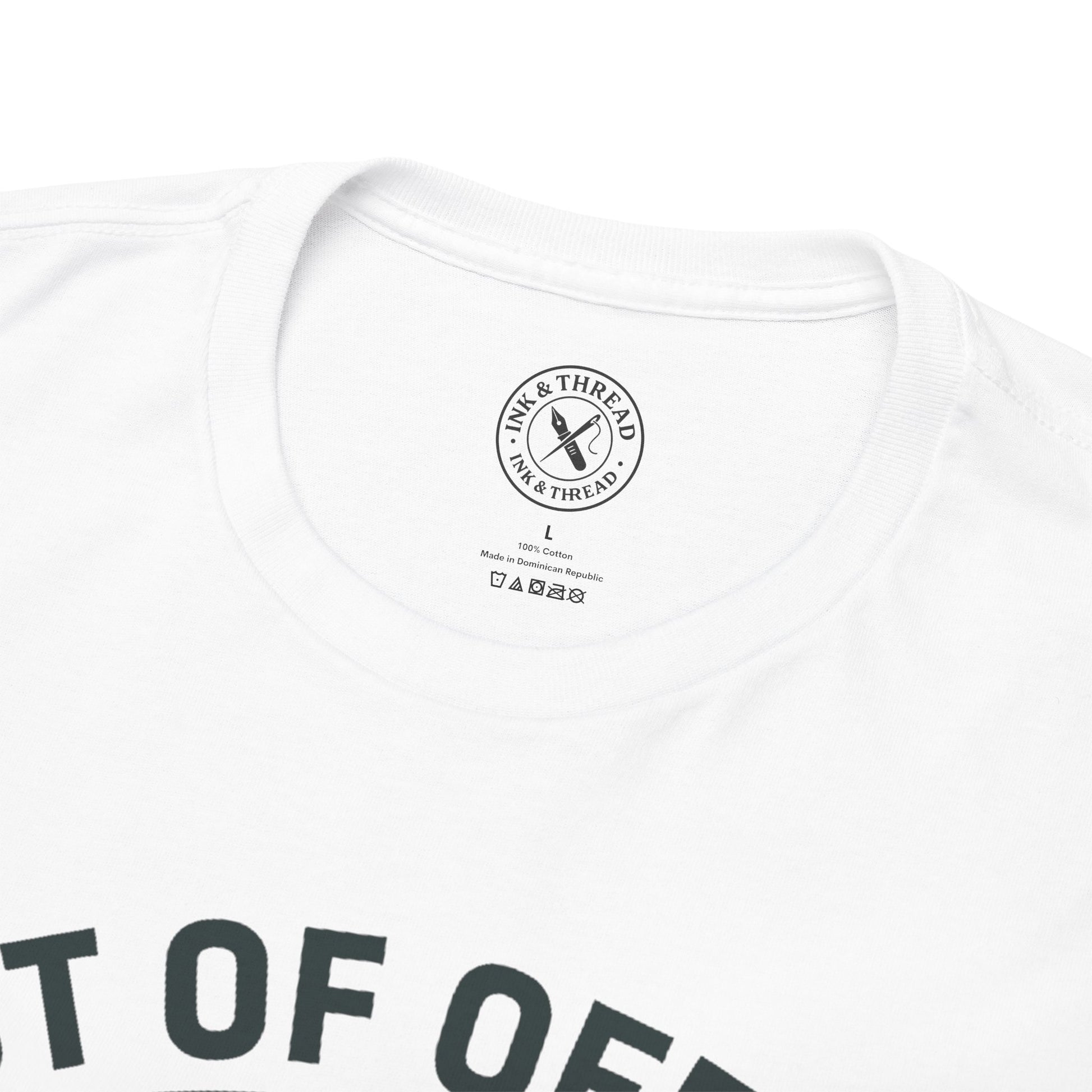 Close-up of Ink and Thread UK branded inner neck label on white t-shirt with Out of Office Permanent graphic design