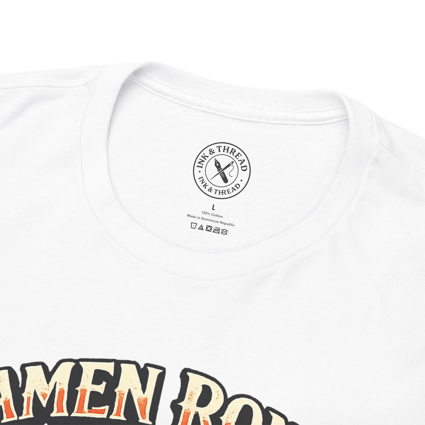 Close-up of Ink & Thread UK branded neck label on Ramen Ronin t-shirt showing quality branding and care instructions