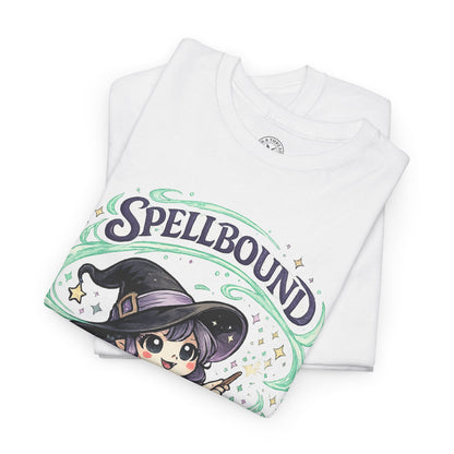 Spellbound white graphic t-shirt folded showing cute anime witch with purple hat and green swirl design